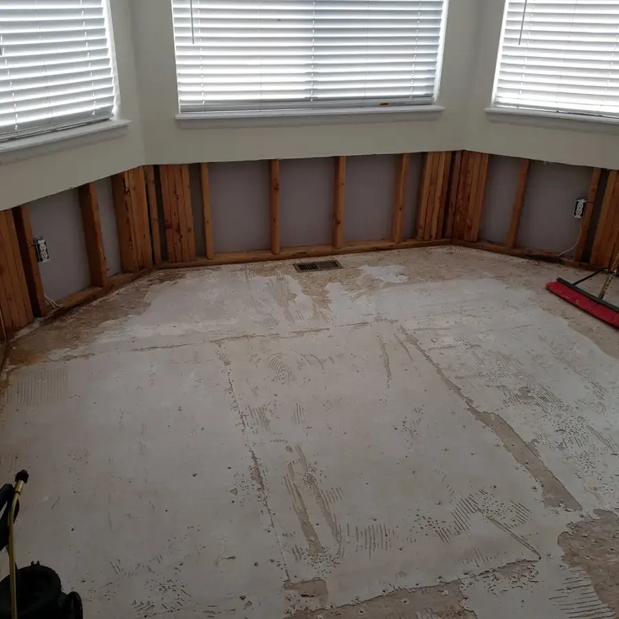 Room with flooring and lower drywall removed after contaminated water