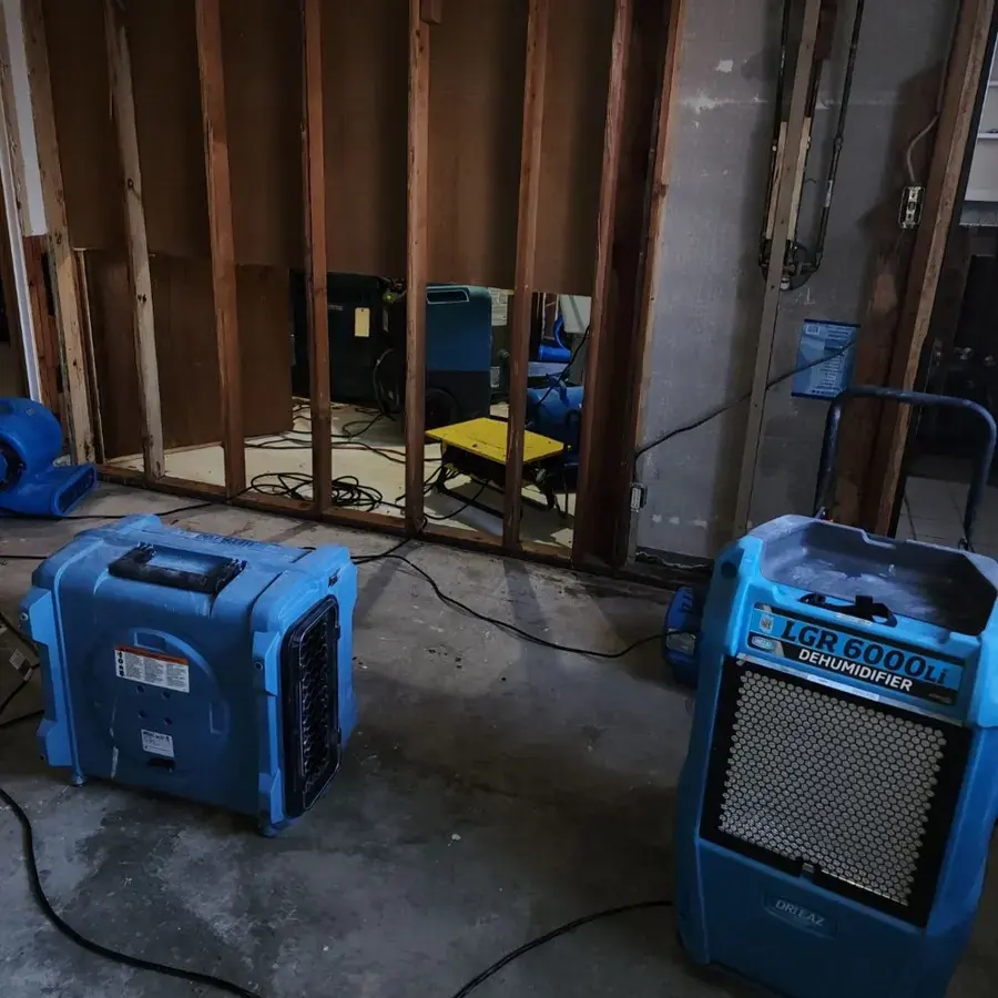 LGR dehumidifiers and air movers drying exposed wall framing